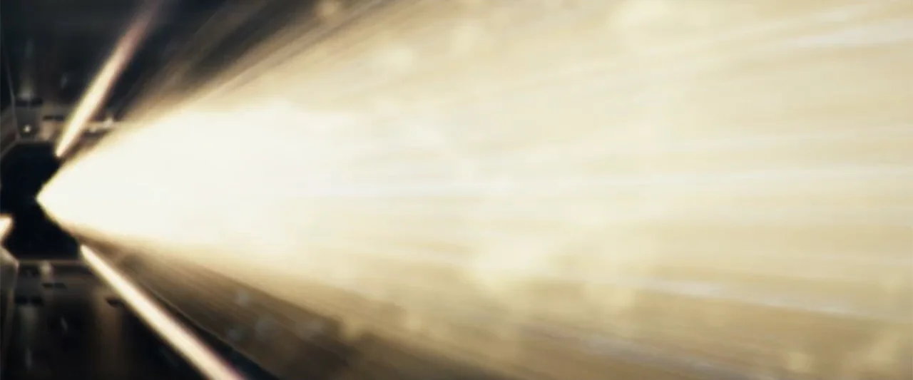 Angels & Demons (2009) movie still: establishing — A dark metallic interior corridor features a powerful shaft of light cutting through haze. The…