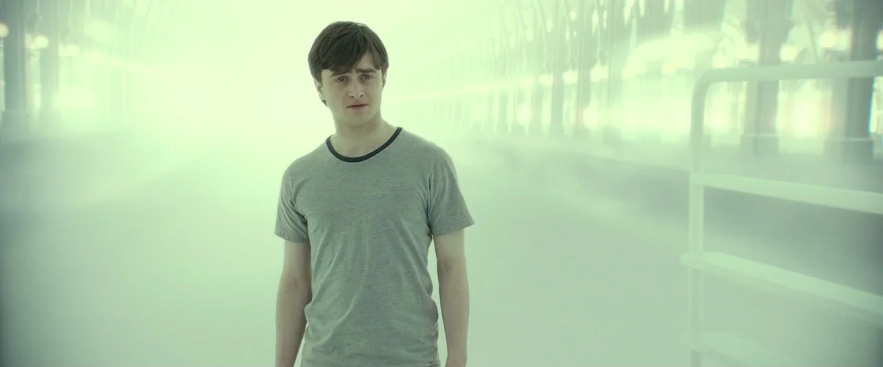 Harry Potter & The Deathly Hallows Part 2 (2011) movie still: medium — A vast, white, fog-covered train station platform stretches into the…
