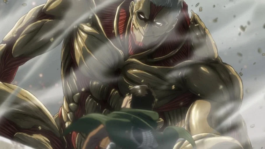 Attack on Titan (2013) movie still: medium — A gargantuan armored titan looms over a small human soldier in a dusty landscape. The soldier stands in…