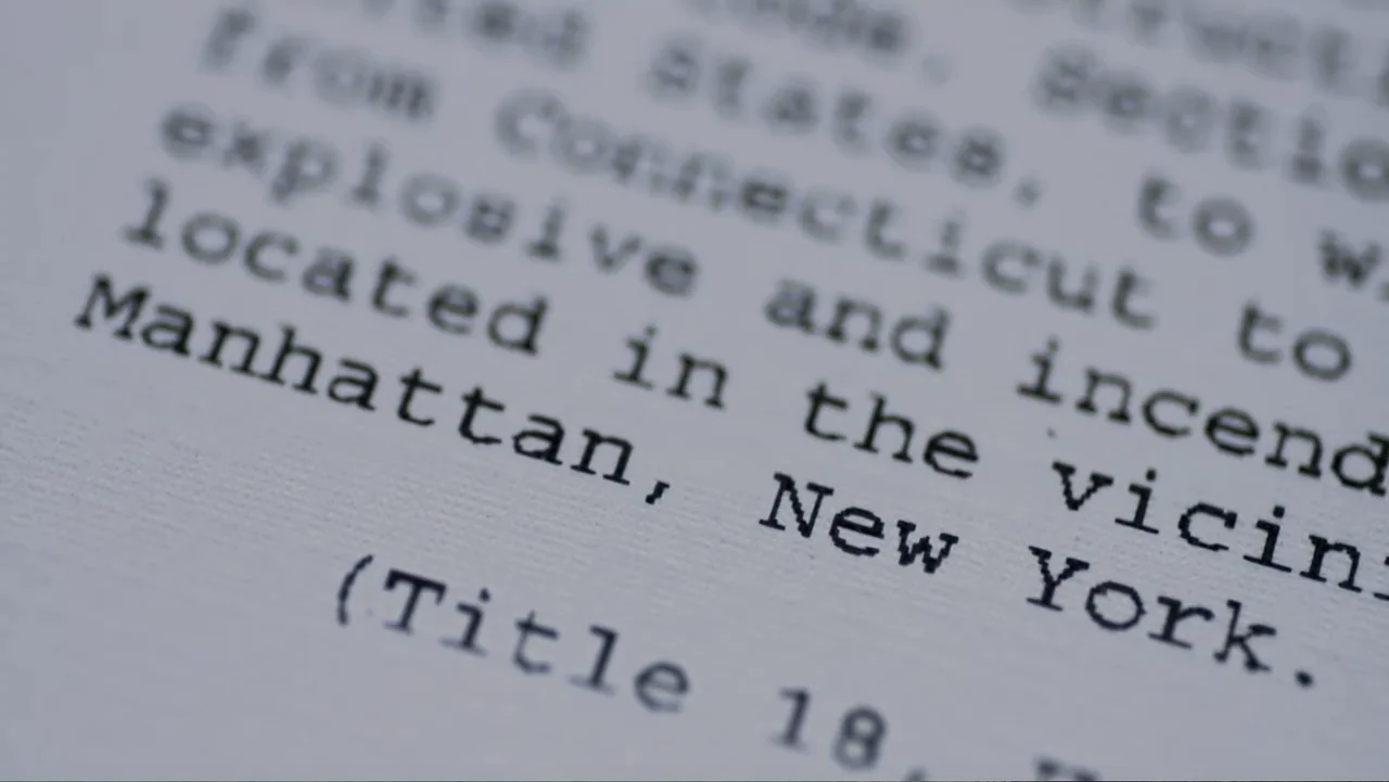 Homegrown: The Counter-Terror Dilemma (2016) movie still: closeup — A close-up of typed text on a piece of paper. The words Manhattan, New York are…
