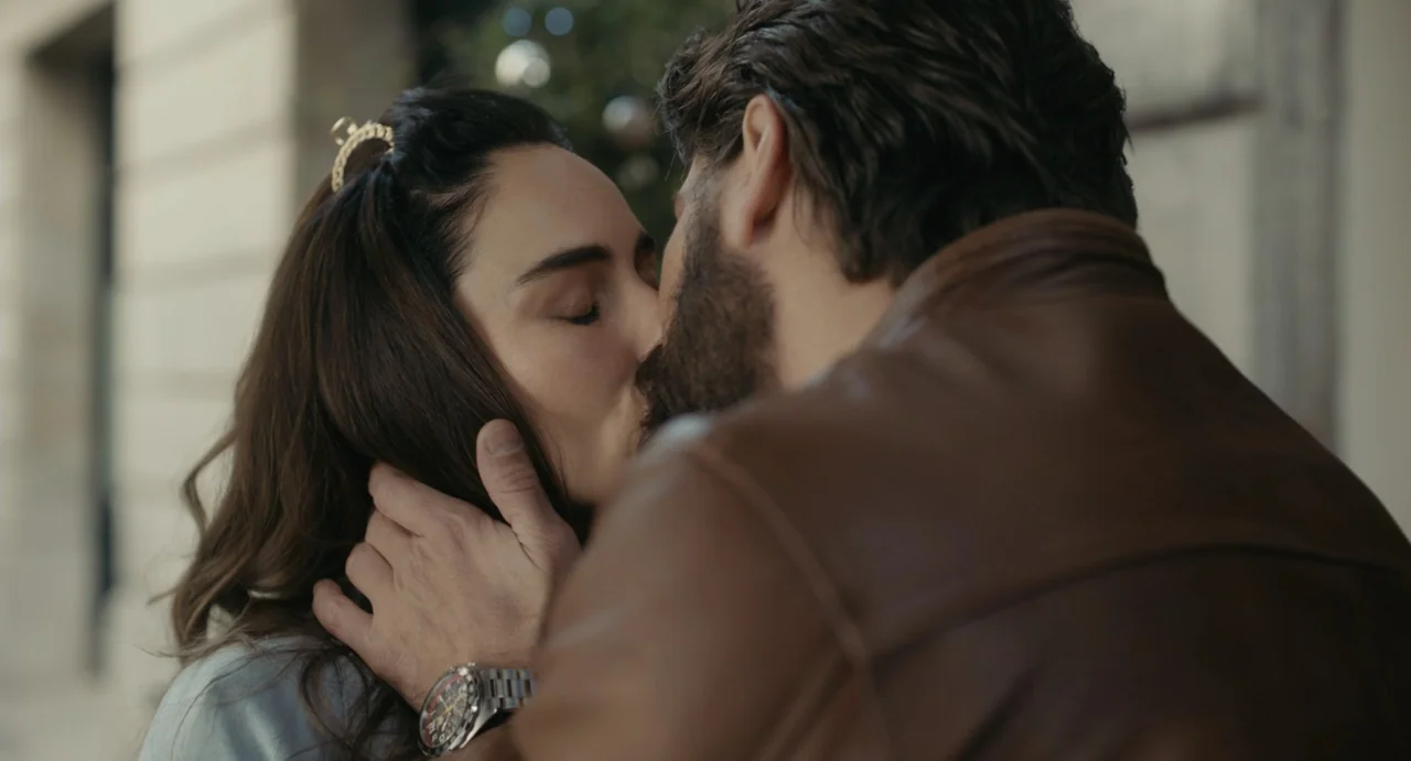 Dating Santa (2023) movie still: closeup — A blurred urban sidewalk with indistinct architectural details forms the backdrop for the subjects. A man…
