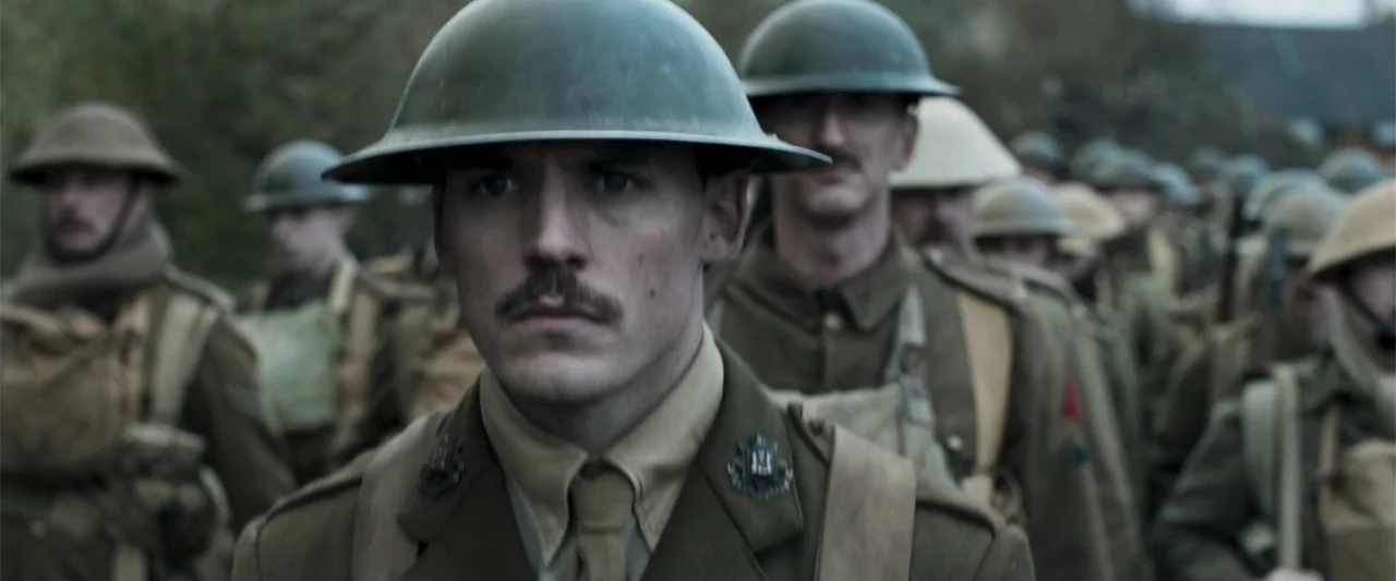 Gone Missing -  Old John's Final Journey (2014) movie still: medium — A formation of soldiers in World War II uniforms marches along a rural track.…