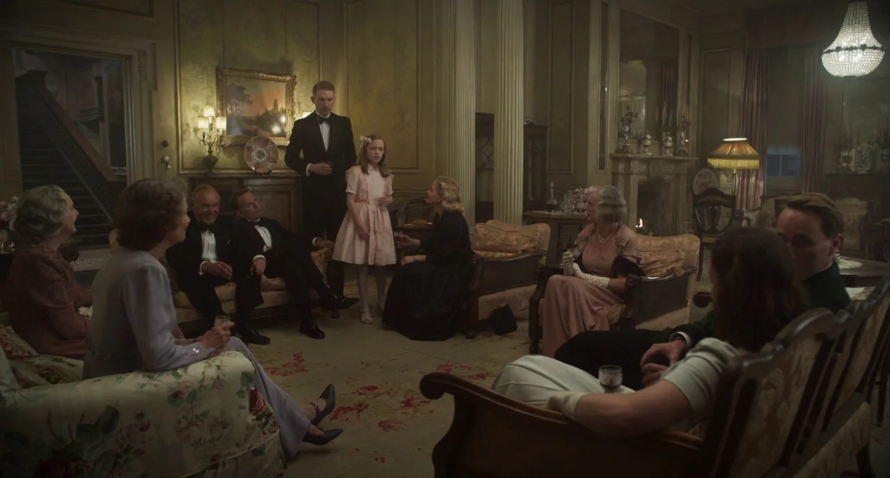 The Little Stranger (2018) movie still: wide — An opulent 1940s drawing room features floral armchairs, ornate gold-framed paintings, and classical…