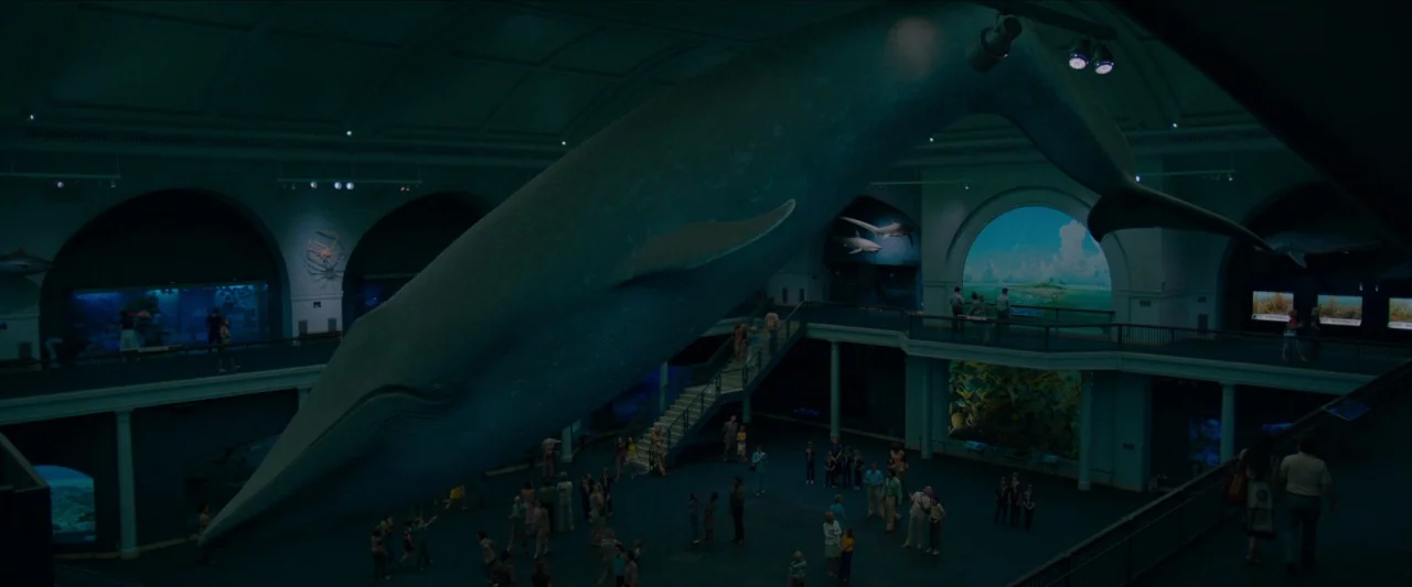 Wonderstruck (2017) movie still: wide — A grand multi-level museum hall features a massive life-sized blue whale model suspended overhead. Numerous…