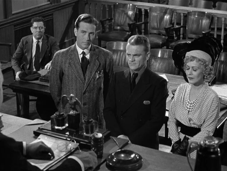 The Roaring Twenties (1939) movie still: medium — A wood-paneled courtroom features rows of empty chairs in the background. Three people stand…
