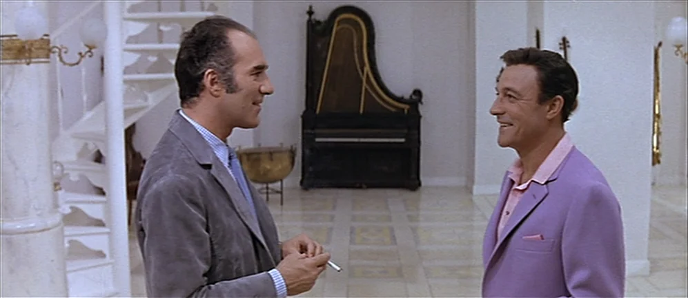 Les Demoiselles de Rochefort (1967) movie still: medium — A bright, high-ceilinged room features white marble columns and a large vertical…