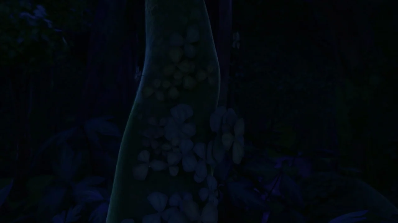 Troll: The Tale of a Tail (2018) movie still: closeup — A dark, dense forest features a prominent tree trunk surface decorated with small flowers.…