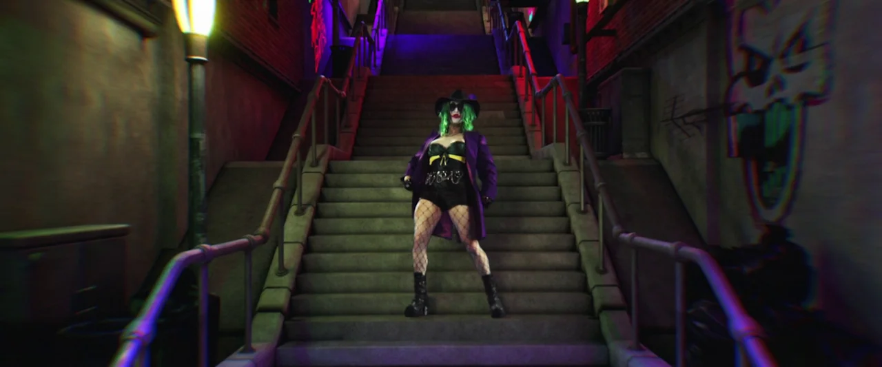 The People’s Joker (2022) movie still: fullbody — A dark outdoor concrete staircase at night is flanked by brick walls with graffiti. A woman…