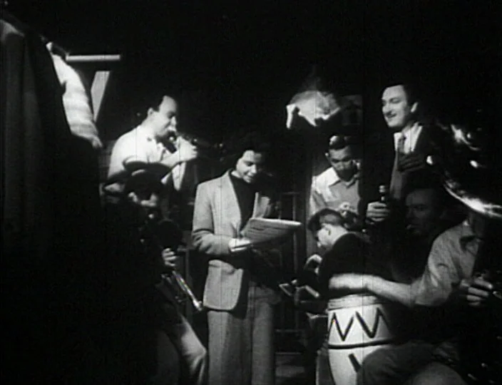 Dementia (Daughter of Horror) (1955) movie still: medium — A dimly lit club interior features a small musical ensemble playing on stage. A man…