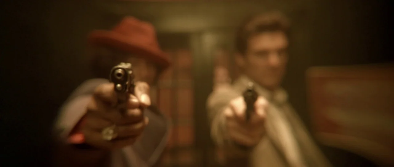 Bones movie still: medium — An interior hallway lit with low-key, warm-toned light. Two men aim pistols directly toward the lens from the foreground.