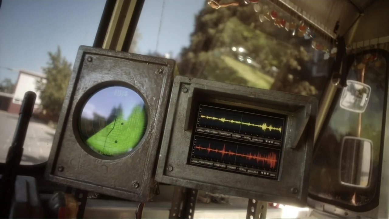 Rufus 2 (2017) movie still: closeup — A dashboard with electronic equipment sits inside a vehicle looking out toward greenery. A circular radar…