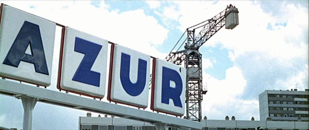 Two or Three Things I Know About Her (2 ou 3 choses que je sais d’elle) (1967) movie still: wide — A large illuminated sign displaying the text AZUR…