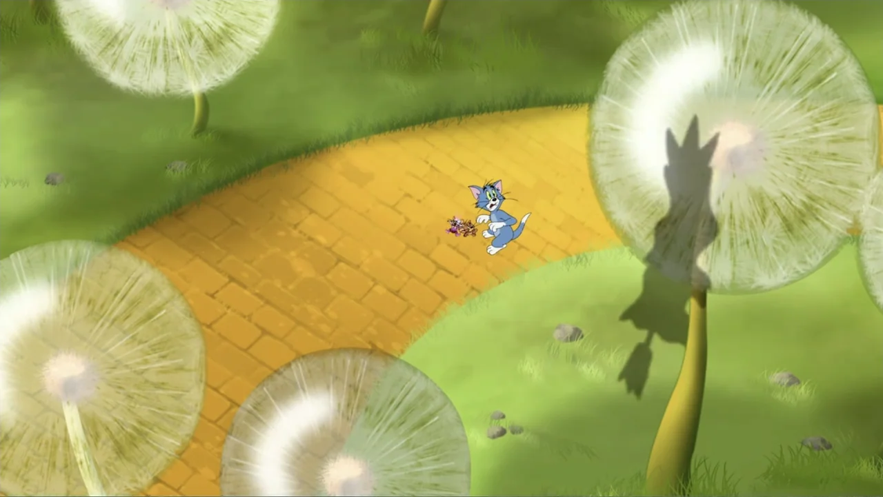 Tom and Jerry & The Wizard of Oz (2011) movie still: wide — A yellow brick path winds through a bright green meadow filled with giant dandelions.…