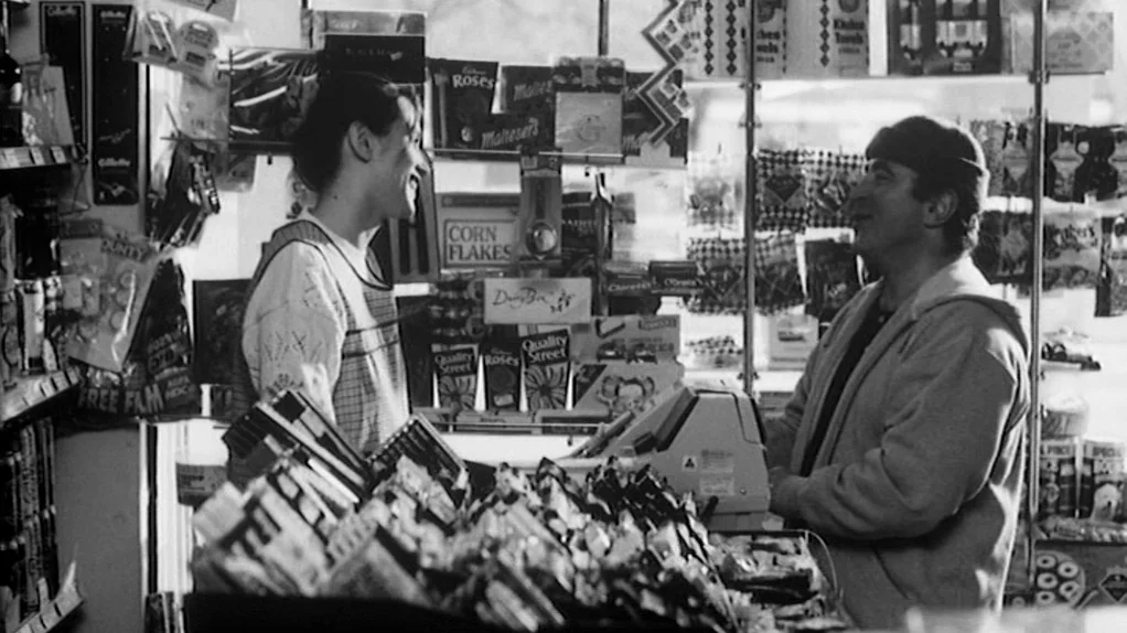 TwentyFourSeven (1997) movie still: medium — A cluttered small convenience store interior with shelves packed with various consumer products. A…