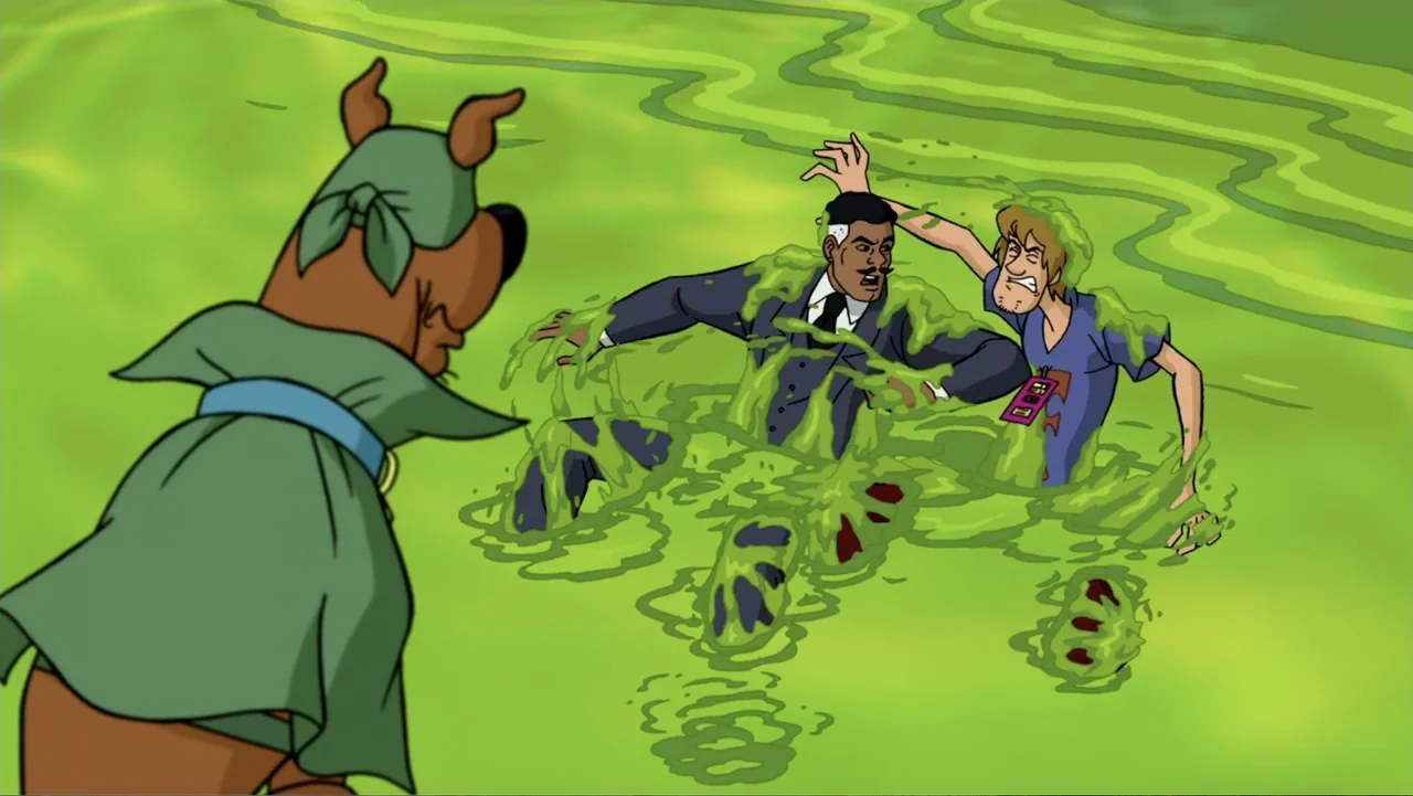 Scooby-Doo! Mask of the Blue Falcon (2012) movie still: medium — Two men are partially submerged in a thick green liquid in a swamp. A dog wearing a…