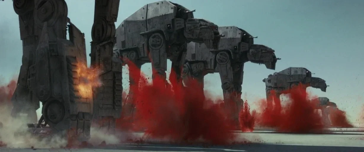 Star Wars: The Last Jedi (2017) movie still: wide — A line of large, grey quadrupedal mechanical walkers moves across a pale, flat surface. Each…