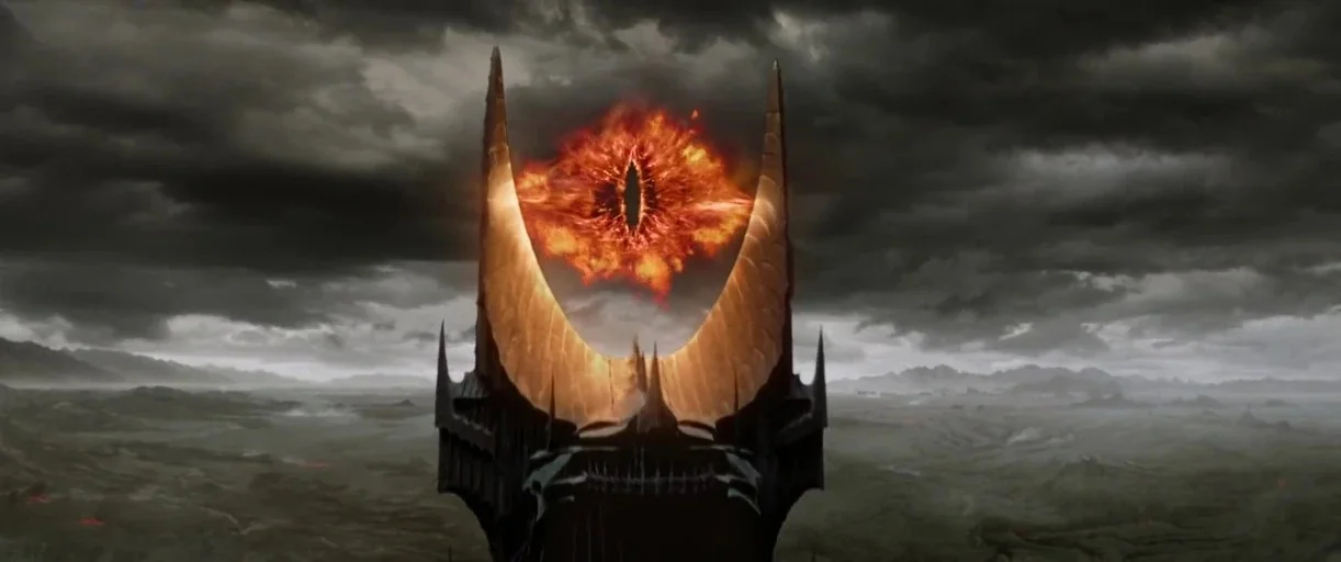 The Lord of The Rings: The Return of the King (2003) movie still: establishing — A colossal dark stone tower stands amidst a desolate and stormy…