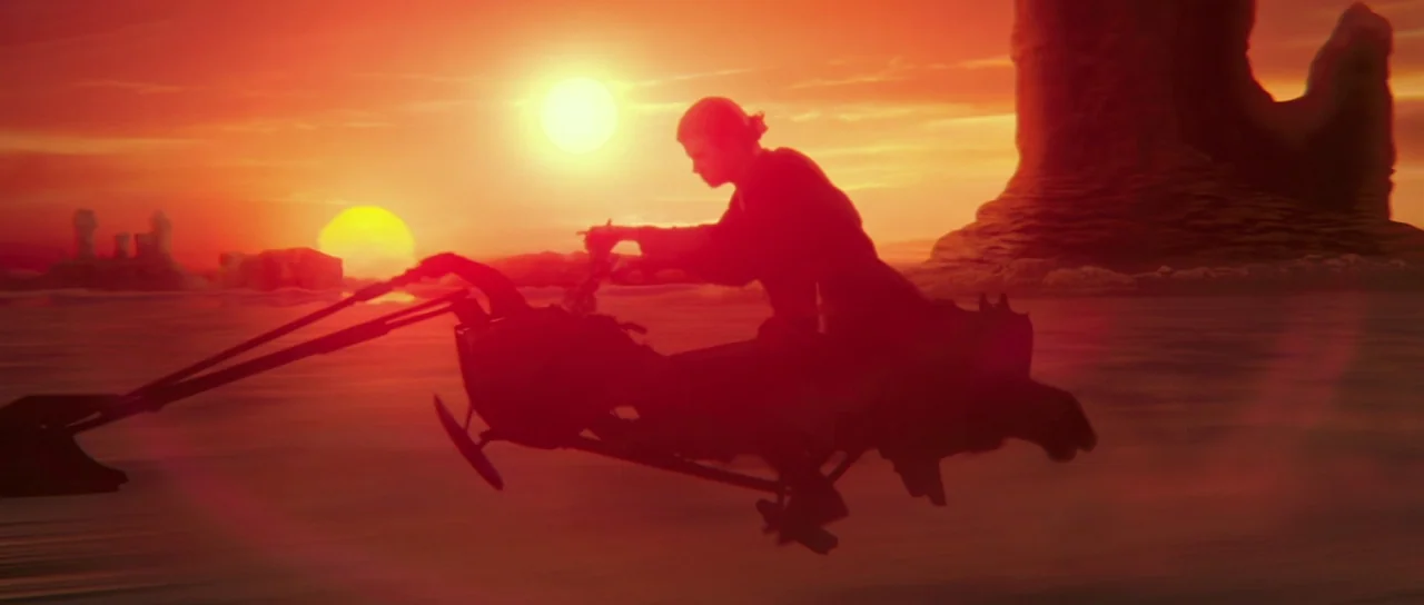 Star Wars: Episode II – Attack of the Clones (2002) movie still: wide — A vast, barren desert landscape with rocky formations under a double sunset.…