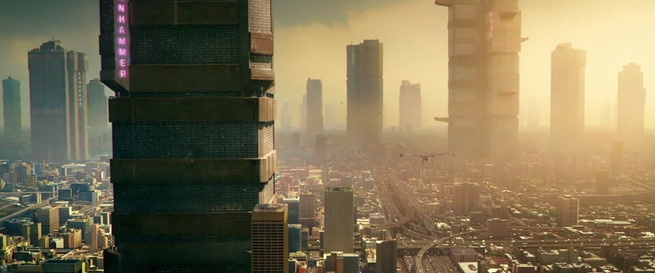 Dredd (2012) movie still: establishing — A dense, expansive future metropolis features enormous brutalist skyscrapers rising above a sprawling…