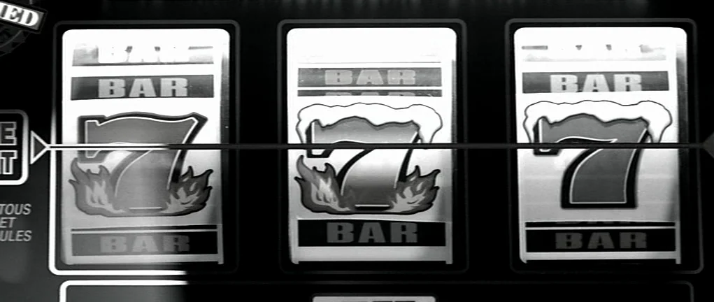 Girl on the Bridge (1999) movie still: closeup — A digital slot machine display shows three reels lined up with winning symbols. The symbols are…