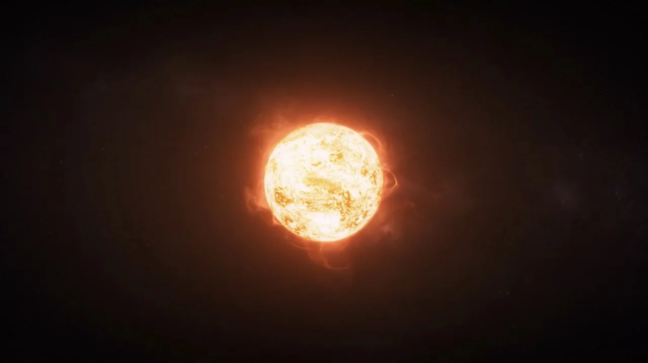 Passengers (2016) movie still: establishing — A glowing star sits centered in the vast darkness of deep space. Solar flares radiate from the surface…