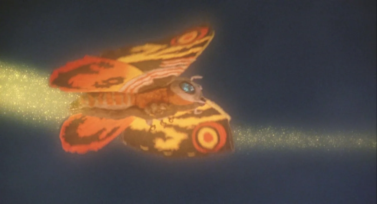 Godzilla and Mothra: The Battle for Earth (1992) movie still: medium — A dark, empty night sky serves as the backdrop for a massive flying creature.…