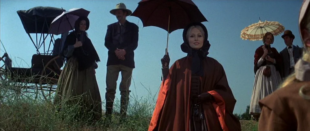 Little Big Man (1970) movie still: fullbody — An open prairie landscape under a clear blue sky contains a group of people. Five individuals in…