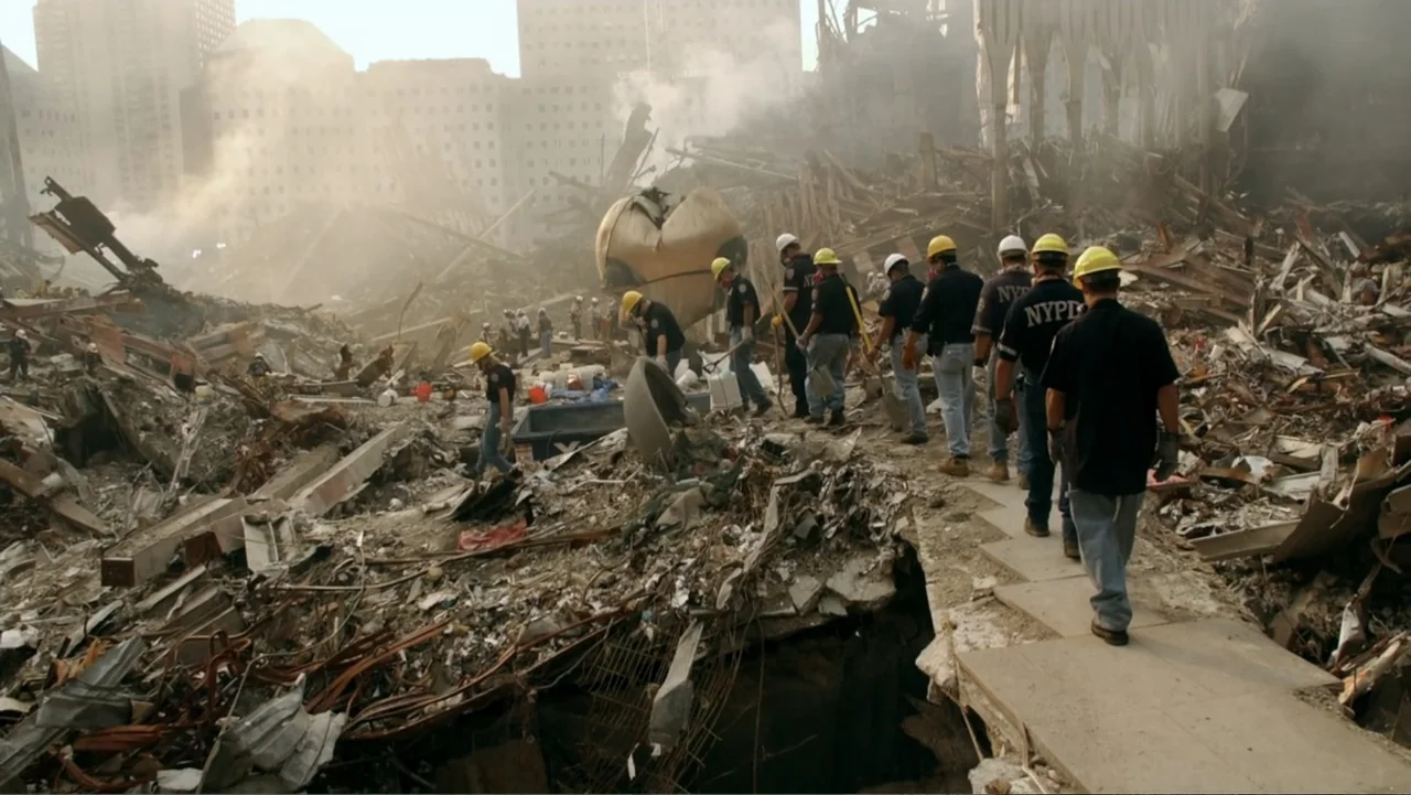 In the Shadow of the Towers: Stuyvesant High on 9/11 (2019) movie still: wide — A vast field of tangled metal and concrete rubble occupies a wide…