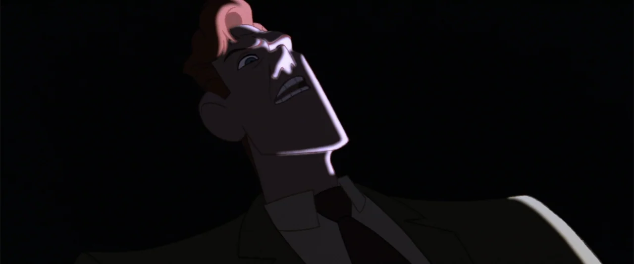 The Iron Giant (1999) movie still: closeup — A dark, nondescript interior space with the subject illuminated against a solid black background. A man…