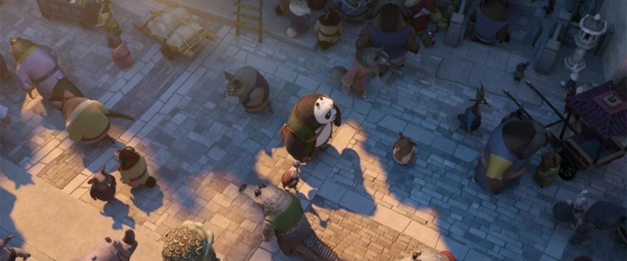 Kung Fu Panda 4 (2024) movie still: wide — A stone-paved marketplace in a fantasy world is filled with various anthropomorphic animal characters. A…