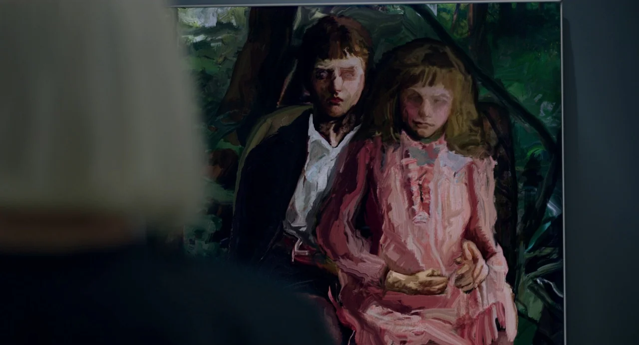 Velvet Buzzsaw (2019) movie still: medium — A dimly lit art gallery wall features a framed oil painting of two children. The painting displays…