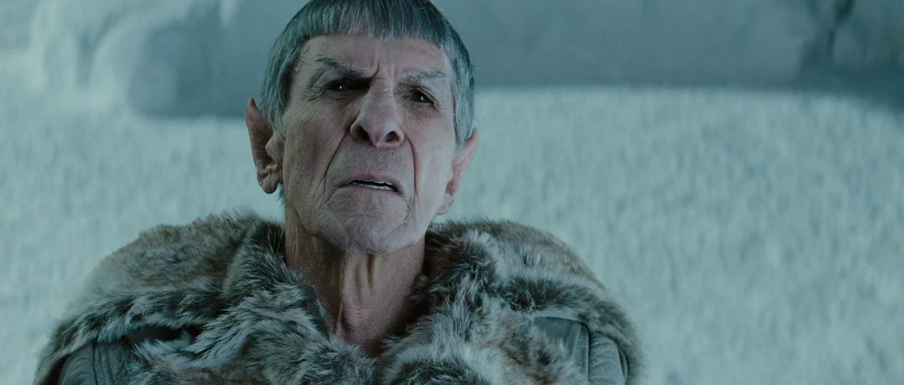 Star Trek (2009) movie still: closeup — An ice-covered, desolate environment with snow-dusted ground visible behind the character. The character…