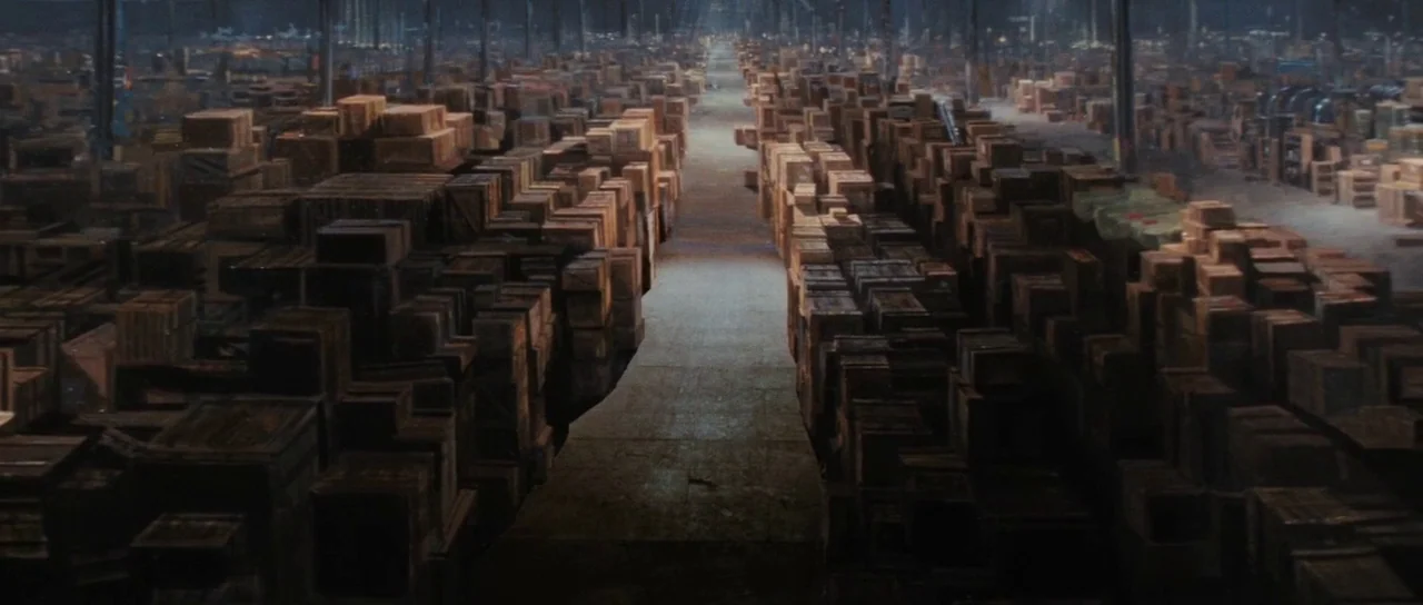 Raiders Of The Lost Ark (1981) movie still: establishing — A vast, cavernous government warehouse interior is filled with endless stacks of wooden…
