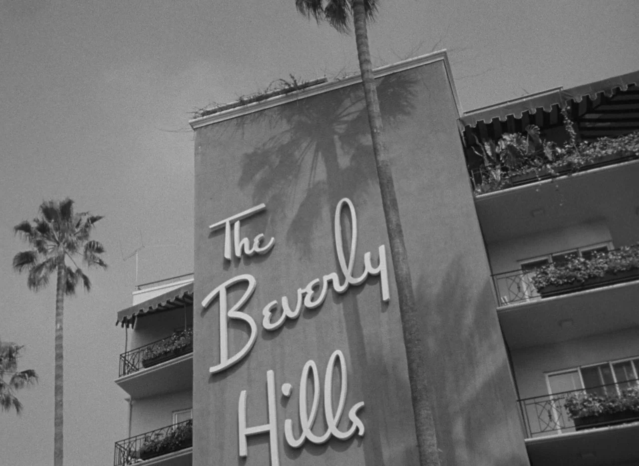The Bad and the Beautiful (1952) movie still: establishing — The exterior of a hotel facade features large cursive signage reading The Beverly…