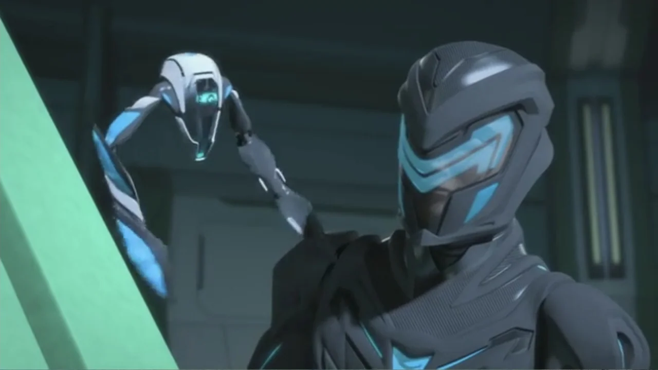 Max Steel: Team Turbo (2016) movie still: medium — A metallic, dark-toned interior corridor features angular geometry and paneled walls. A humanoid…