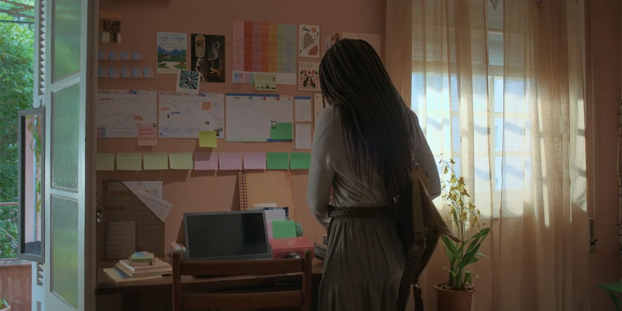 An Unforgettable Year - Autumn (2023) movie still: medium — A light-walled home office features a desk covered with notes and a wall calendar. A…