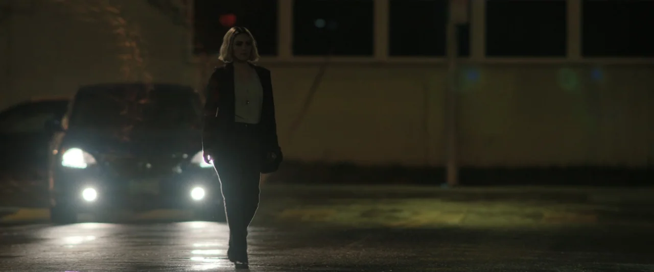 True Account: Breaking the Truce (Yakuza Bloody Chronicles 2) (2007) movie still: fullbody — An asphalt expanse at night is illuminated by the harsh…