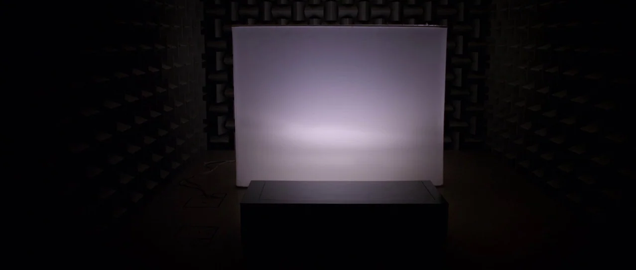 Vanishing Waves (2012) movie still: wide — An anechoic chamber features dark, pyramid-shaped acoustic foam lining all walls. A large rectangular…