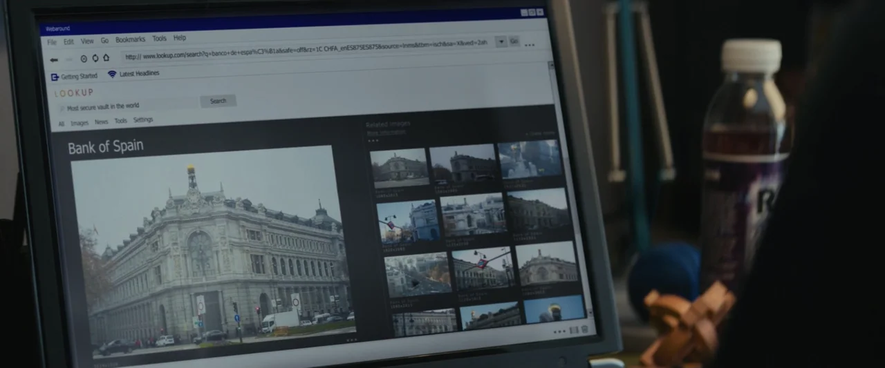 The Vault (2021) movie still: closeup — A computer monitor shows a web browser interface with an image search results page. The screen contents…