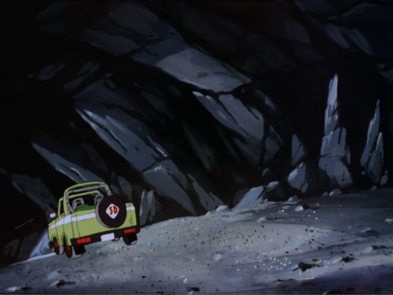 Scooby-Doo! Meets the Boo Brothers (1987) movie still: wide — A light green utility vehicle sits parked on the dark stone floor of a cavern. The…