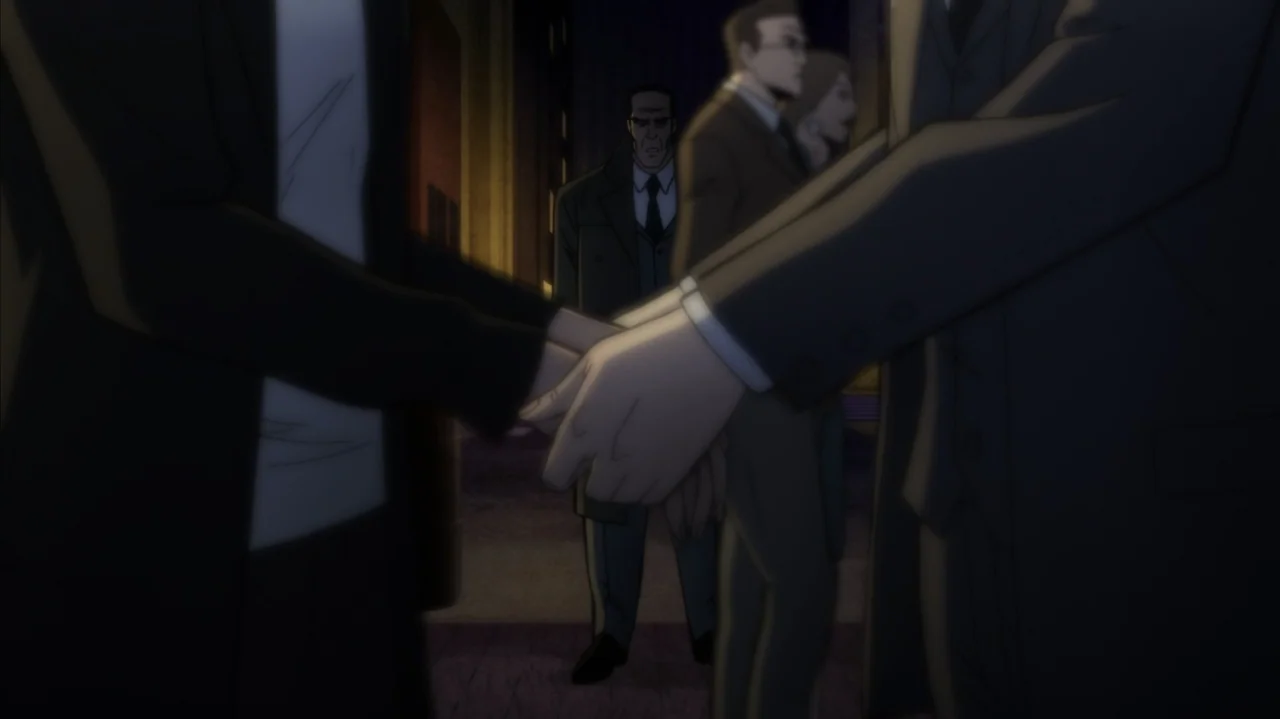 Batman: The Long Halloween, Part Two (2021) movie still: medium — A dark city street at night shows several figures in formal period attire. Two men…