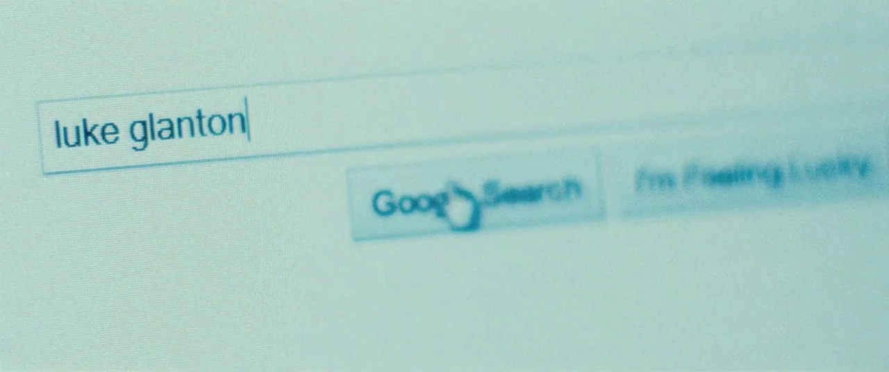 The Place Beyond The Pines (2012) movie still: closeup — A close-up of a computer monitor displaying a search engine interface with text. The cursor…