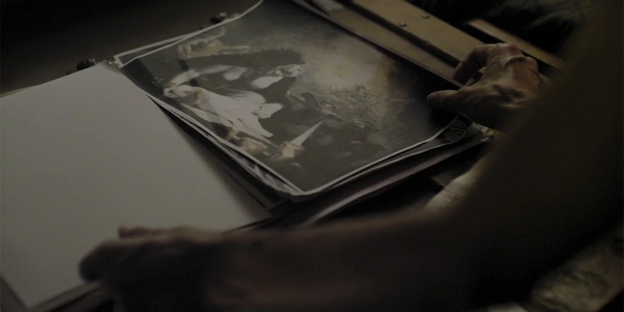 Stalked by My Doctor: A Sleepwalker's Nightmare (2019) movie still: closeup — An interior space contains a person flipping through pages of a…