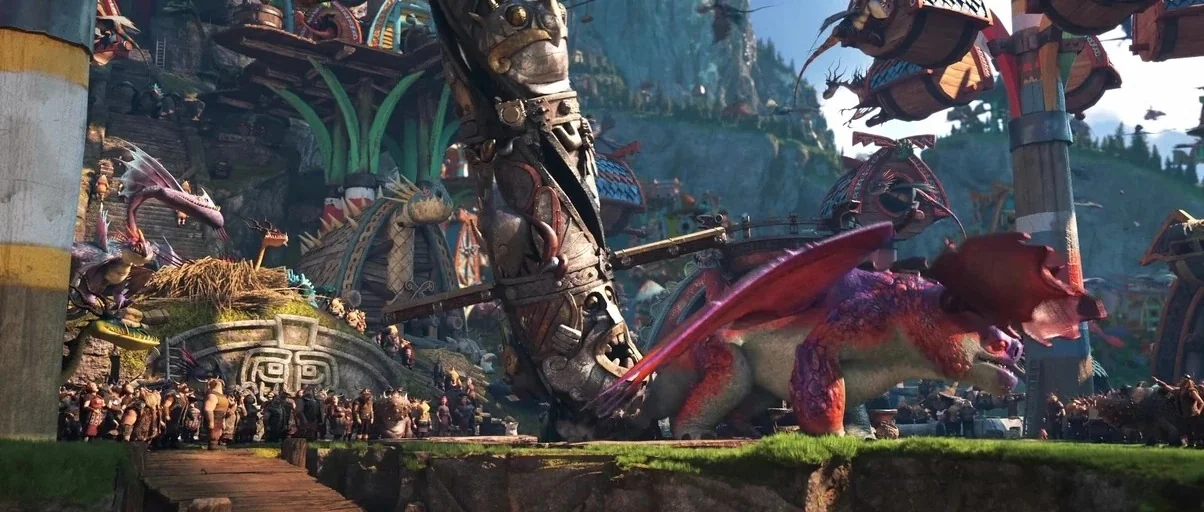 How to Train Your Dragon: The Hidden World (2019) movie still: wide — A bustling fantasy village is filled with large wooden structures and carved…