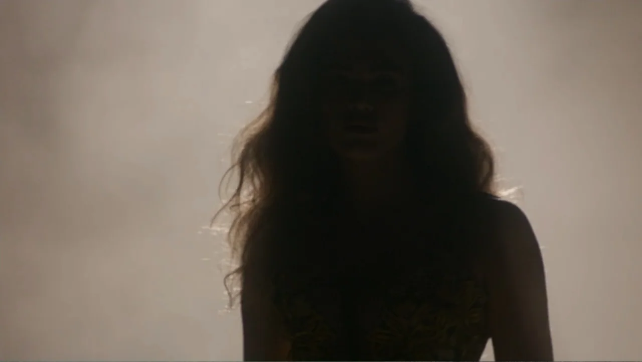 Victoria's Secret: The Tour '23 (2023) movie still: medium — A person stands in a hazy space illuminated from behind by an intense light. The…