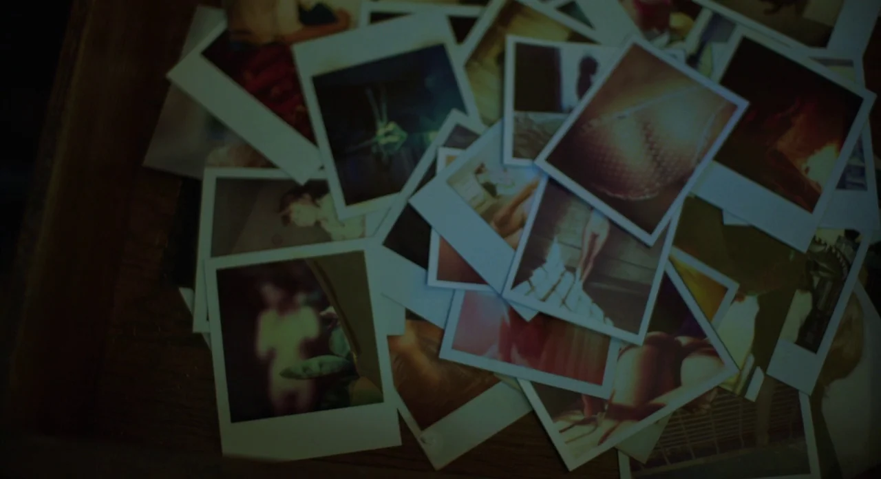 A Glimpse Inside The Mind Of Charles Swan III (2013) movie still: closeup — A collection of assorted polaroid photographs is scattered inside a dark…