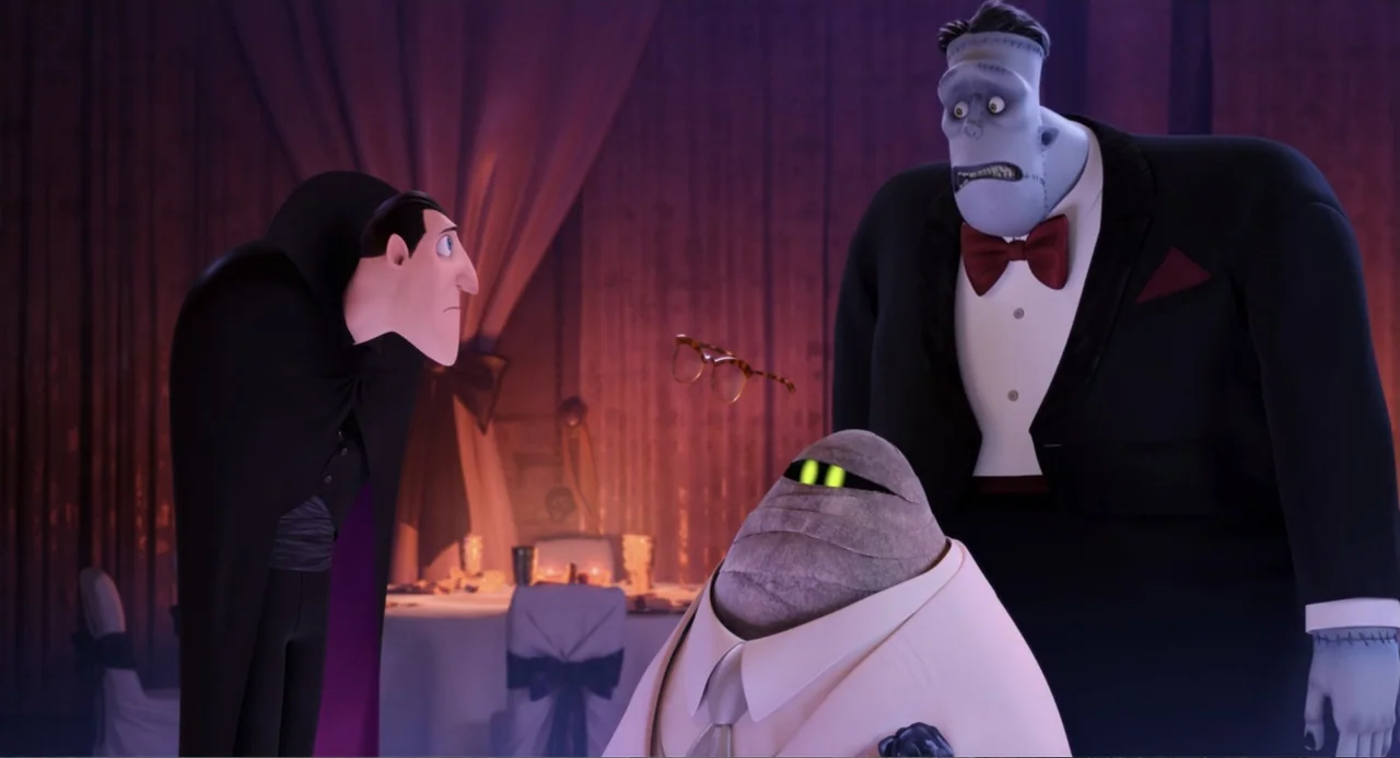 Hotel Transylvania 3: Summer Vacation (2018) movie still: medium — A dimly lit room with purple curtains and tables set for a banquet. A vampire, a…