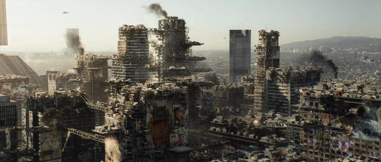 Elysium (2013) movie still: establishing — A sprawling futuristic city landscape features densely packed decaying skyscrapers connected by extensive…