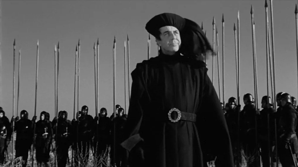 Falstaff (Chimes at Midnight) (1965) movie still: medium — A line of soldiers stands in an open field against a clear sky. A central leader wearing…