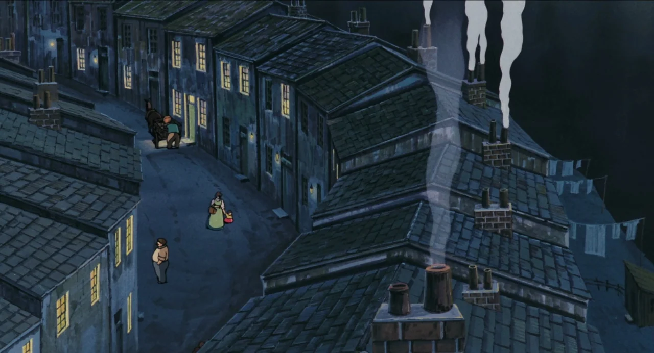 Castle in the Sky (1986) movie still: establishing — A cluster of dark, slate-roofed brick houses lines a narrow, shadowed cobblestone street at…